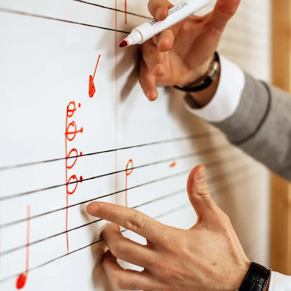 sspp-man-writing-music-notes sspp-man-writing-music-notes